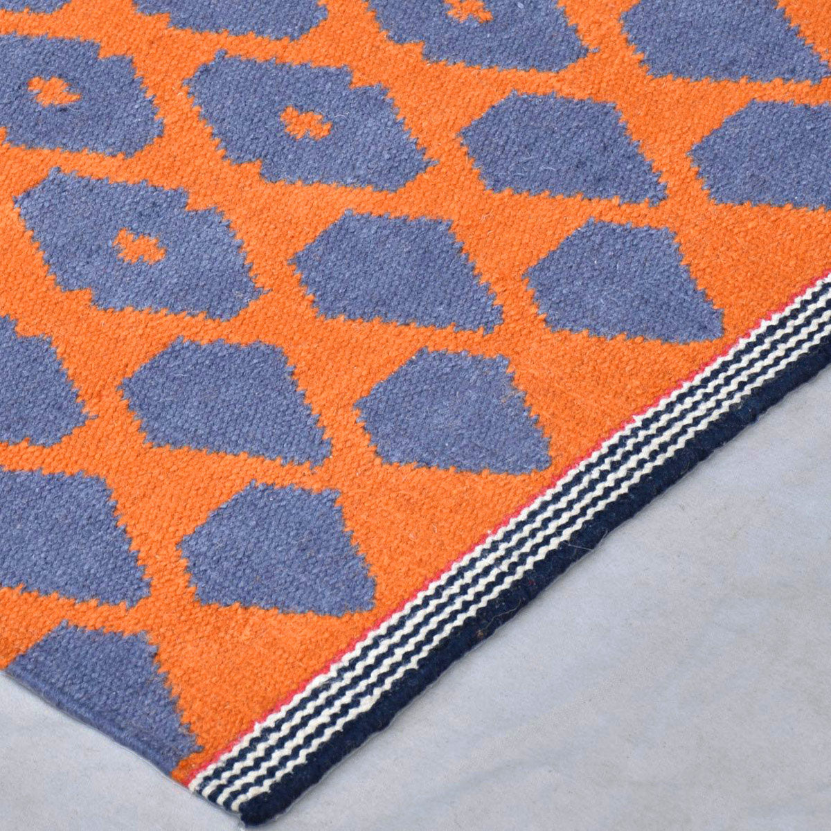 Geometric pattern, colourful rugs, designer rugs, luxury rugs, wool rugs, geometric rug, modern rug, orange rug, red rug